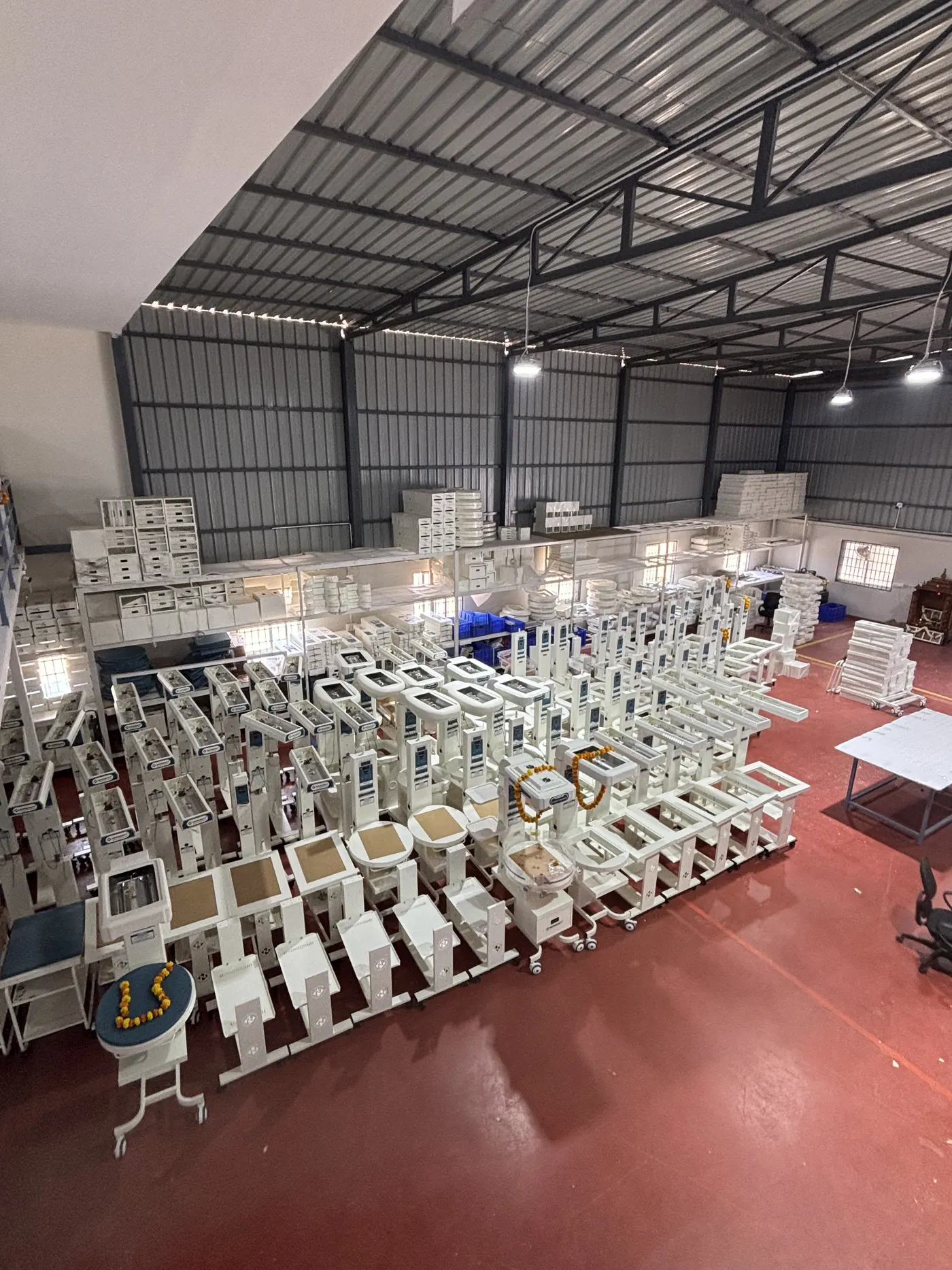 Batch of finished sheet metal enclosures stacked at a customer warehouse