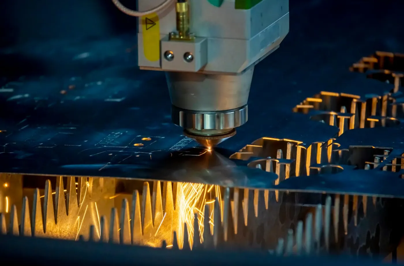 Fibre laser cutting CNC machine cutting sheet metal on the factory floor